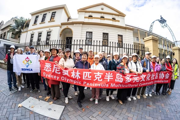 SOPMCA volunteers holding handmade zongzi at Wentworth Point Library